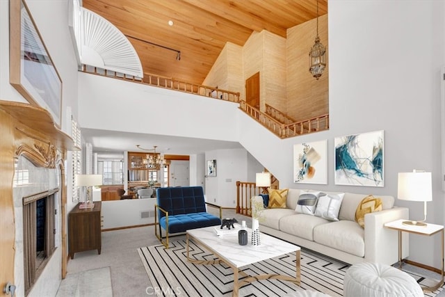 1110 Esplanade Unit 6, Redondo Beach, CA 90277 - living area featuring high vaulted ceiling, wooden ceiling, a chandelier, carpet, and a fireplace