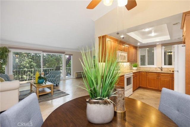 124 Via Estrada Unit O, Laguna Woods, CA 92637 - dining area with a ceiling fan and a raised ceiling