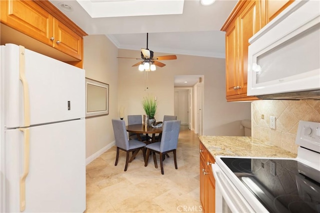 124 Via Estrada Unit O, Laguna Woods, CA 92637 - kitchen with white appliances, tasteful backsplash, ornamental molding, brown cabinets, and baseboards