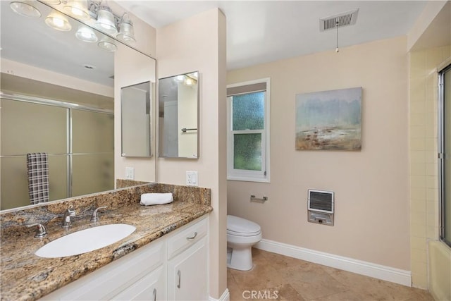 124 Via Estrada Unit O, Laguna Woods, CA 92637 - bathroom with baseboards, vanity, toilet, heating unit, and tile patterned flooring