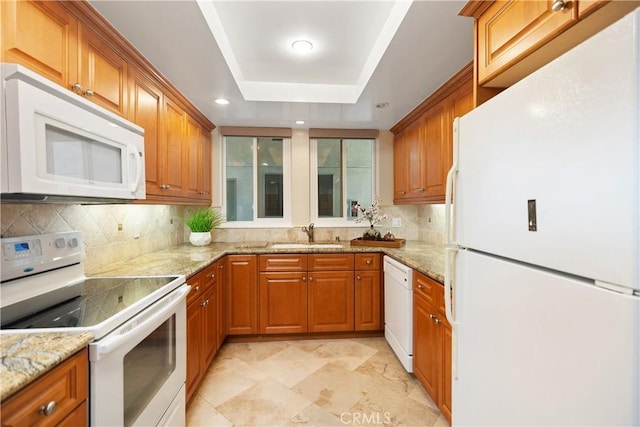 124 Via Estrada Unit O, Laguna Woods, CA 92637 - kitchen featuring white appliances, a sink, brown cabinetry, decorative backsplash, and recessed lighting