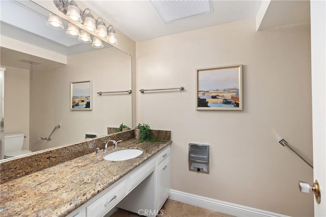 124 Via Estrada Unit O, Laguna Woods, CA 92637 - bathroom featuring vanity, toilet, heating unit, and baseboards