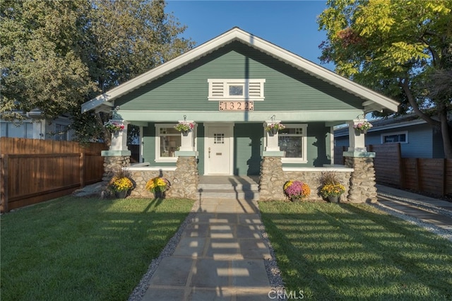 1322 N June St, Los Angeles, CA 90028 - view of front of property featuring covered porch and stone siding