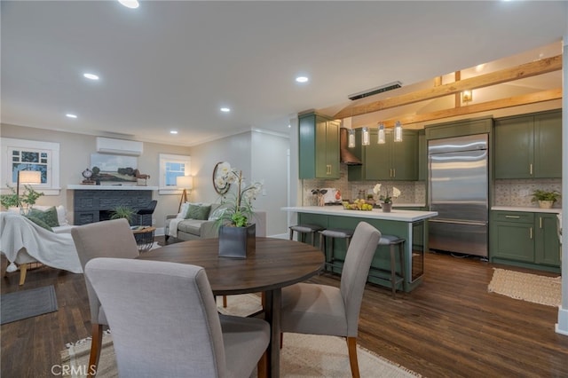 1322 N June St, Los Angeles, CA 90028 - dining room featuring a wall mounted air conditioner, dark wood finished floors, a fireplace, recessed lighting, and ornamental molding