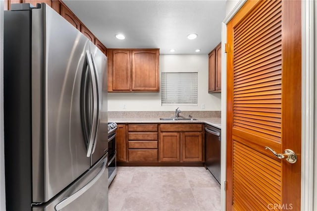 8313 Vineyard Ave # 6, Rancho Cucamonga, CA 91730 - kitchen with stainless steel appliances, a sink, brown cabinets, light countertops, and recessed lighting