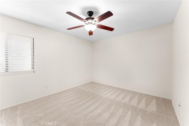 8313 Vineyard Ave # 6, Rancho Cucamonga, CA 91730 - empty room featuring carpet floors, a ceiling fan, a textured ceiling, and baseboards