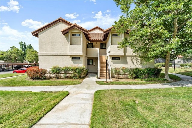 8313 Vineyard Ave # 6, Rancho Cucamonga, CA 91730 - multi unit property featuring stairway, a front lawn, a tile roof, and stucco siding