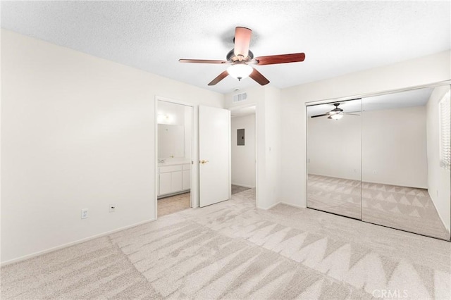 8313 Vineyard Ave # 6, Rancho Cucamonga, CA 91730 - unfurnished bedroom featuring carpet, electric panel, a closet, connected bathroom, and a ceiling fan