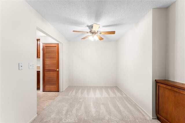 8313 Vineyard Ave # 6, Rancho Cucamonga, CA 91730 - unfurnished room featuring ceiling fan, light carpet, a textured ceiling, and baseboards