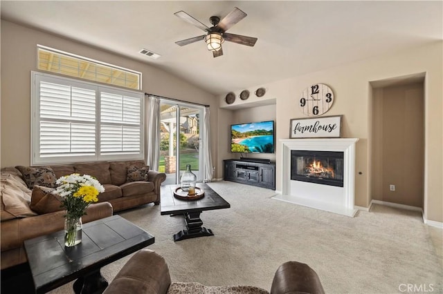 5058 Meadowsweet Dr, Palmdale, CA 93551 - living area with ceiling fan, lofted ceiling, carpet, a fireplace with flush hearth, and baseboards