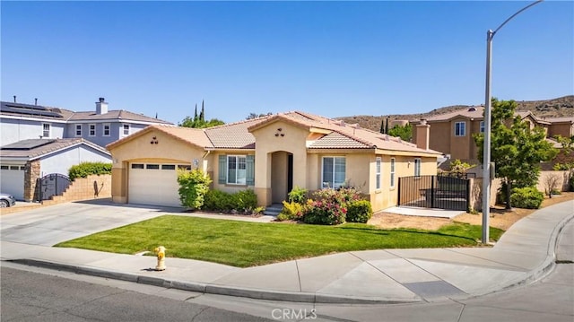 5058 Meadowsweet Dr, Palmdale, CA 93551 - mediterranean / spanish-style house with a tiled roof, stucco siding, concrete driveway, and an attached garage