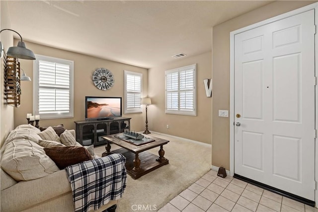 5058 Meadowsweet Dr, Palmdale, CA 93551 - living room featuring baseboards, light carpet, and light tile patterned floors