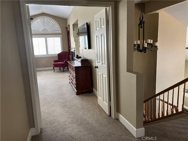 7440 Apple Blossom Ct, Highland, CA 92346 - hall featuring carpet floors, a chandelier, lofted ceiling, and baseboards