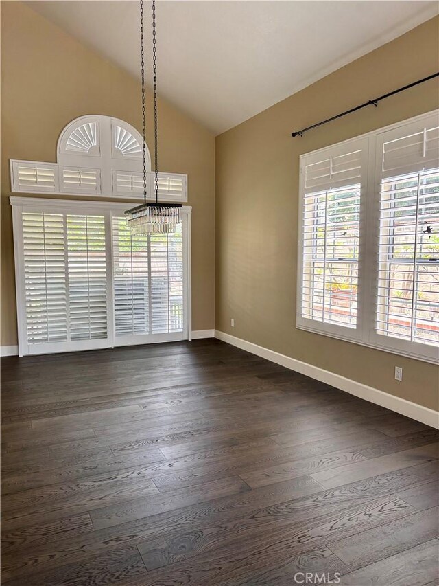 7440 Apple Blossom Ct, Highland, CA 92346 - spare room with vaulted ceiling, baseboards, and dark wood-type flooring