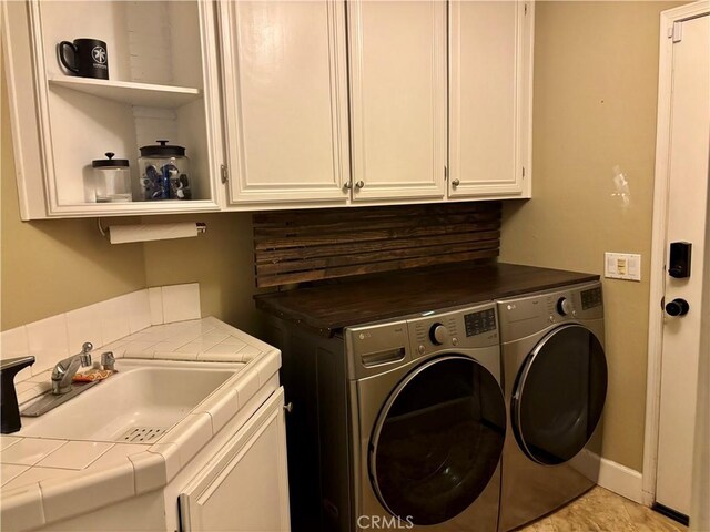 7440 Apple Blossom Ct, Highland, CA 92346 - laundry room with cabinet space and independent washer and dryer