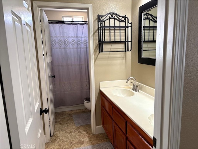 7440 Apple Blossom Ct, Highland, CA 92346 - full bathroom with a textured wall, vanity, toilet, and shower / tub combo