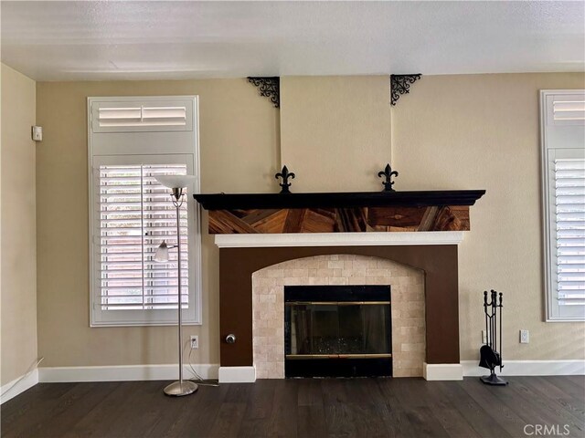 7440 Apple Blossom Ct, Highland, CA 92346 - detailed view of baseboards, wood finished floors, and a glass covered fireplace