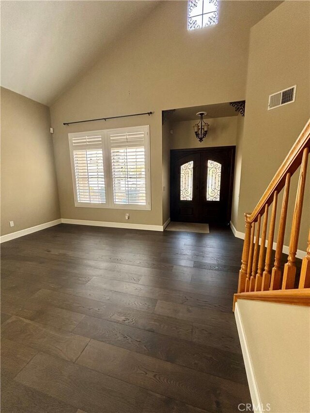 7440 Apple Blossom Ct, Highland, CA 92346 - entrance foyer featuring dark wood-type flooring, french doors, high vaulted ceiling, baseboards, and stairs