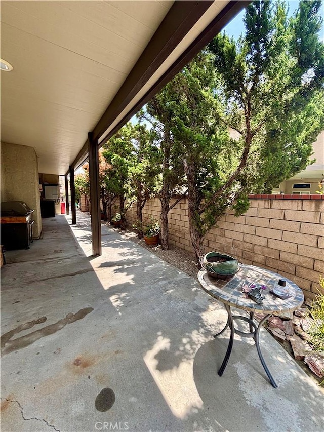 7440 Apple Blossom Ct, Highland, CA 92346 - fenced backyard featuring a patio area and area for grilling