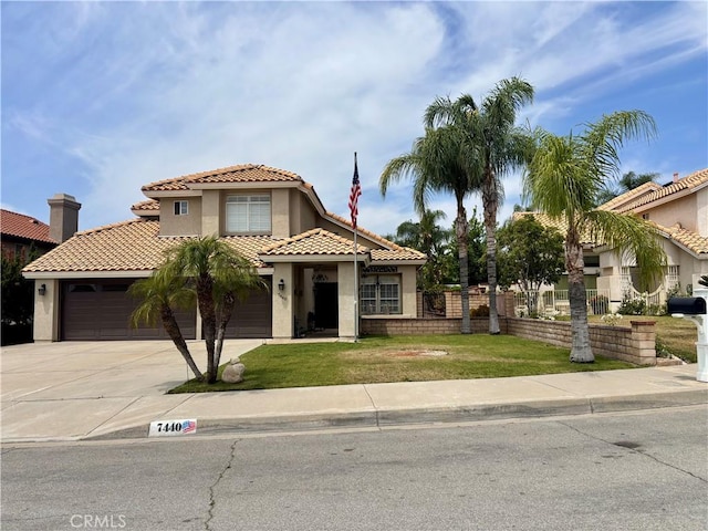 7440 Apple Blossom Ct, Highland, CA 92346 - view of front of house featuring stucco siding, driveway, a tiled roof, and an attached garage