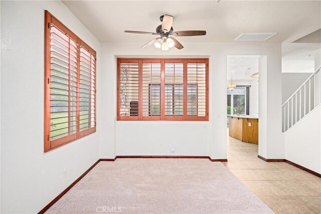 15863 Falcon Ct, Fontana, CA 92337 - empty room with a ceiling fan, stairs, baseboards, and carpet