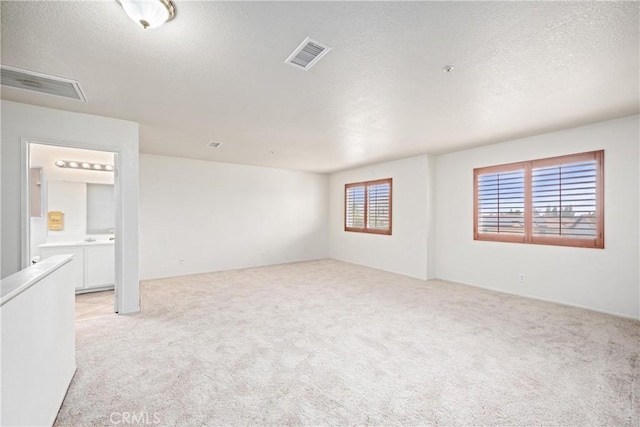 15863 Falcon Ct, Fontana, CA 92337 - empty room featuring light colored carpet and a textured ceiling