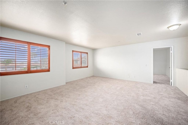 15863 Falcon Ct, Fontana, CA 92337 - carpeted empty room with a textured ceiling