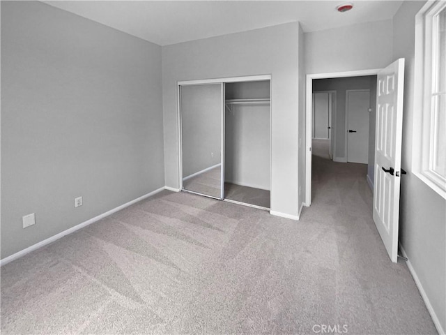 1281 Smoke Tree Ln, Beaumont, CA 92223 - unfurnished bedroom featuring carpet floors, baseboards, and a closet