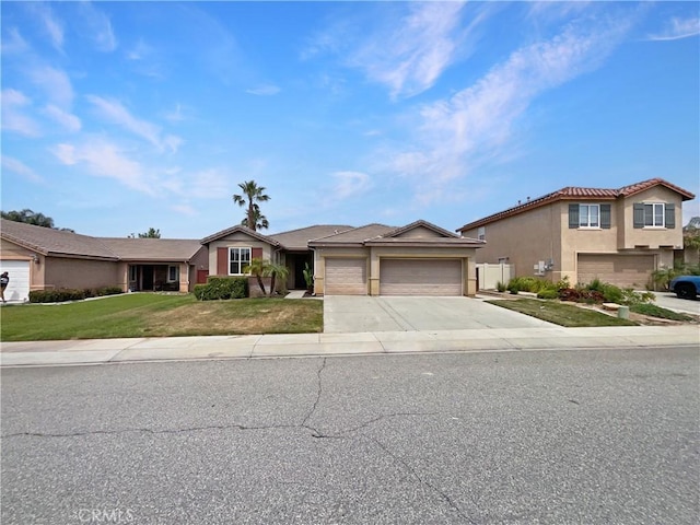 1281 Smoke Tree Ln, Beaumont, CA 92223 - view of front facade with an attached garage, driveway, stucco siding, and a front yard