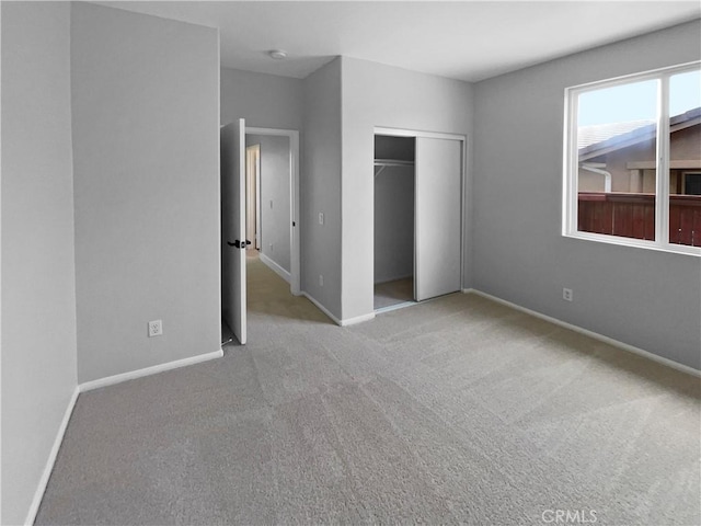 1281 Smoke Tree Ln, Beaumont, CA 92223 - unfurnished bedroom featuring carpet floors, a closet, and baseboards