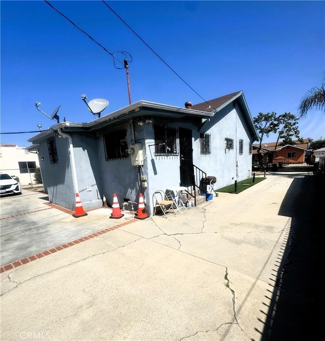 1022 W 103rd St, Los Angeles, CA 90044 - rear view of house with stucco siding