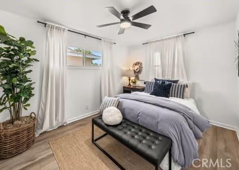 10946 Kentucky Ave, Whittier, CA 90603 - bedroom featuring wood finished floors, baseboards, and ceiling fan