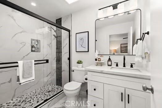 10946 Kentucky Ave, Whittier, CA 90603 - full bath with toilet, vanity, a marble finish shower, and marble finish flooring