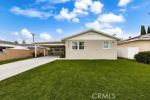 10946 Kentucky Ave, Whittier, CA 90603 - rear view of house with driveway, an attached carport, and stucco siding