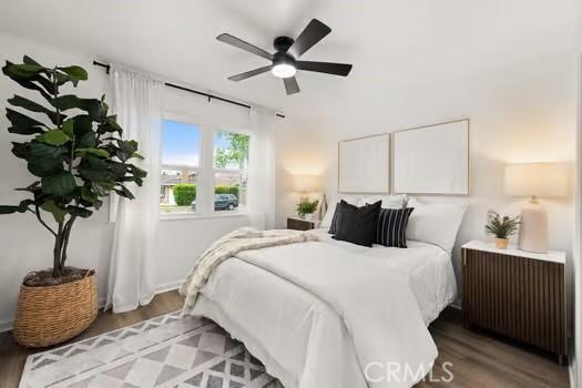 10946 Kentucky Ave, Whittier, CA 90603 - bedroom featuring wood finished floors, a ceiling fan, and radiator