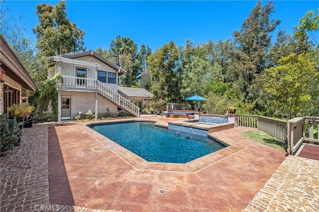 7626 E Saddlehill Trl, Orange, CA 92869 - view of swimming pool featuring stairs, a hot tub, and a patio area