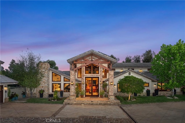 7626 E Saddlehill Trl, Orange, CA 92869 - contemporary house featuring french doors and stone siding