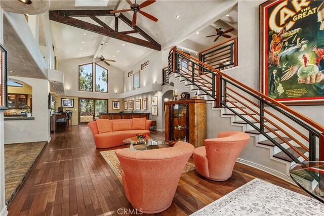 7626 E Saddlehill Trl, Orange, CA 92869 - living room featuring a ceiling fan, high vaulted ceiling, wood-type flooring, stairs, and beamed ceiling