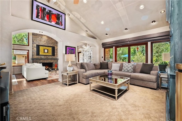 7626 E Saddlehill Trl, Orange, CA 92869 - living area with wood finished floors, a fireplace, plenty of natural light, recessed lighting, and high vaulted ceiling