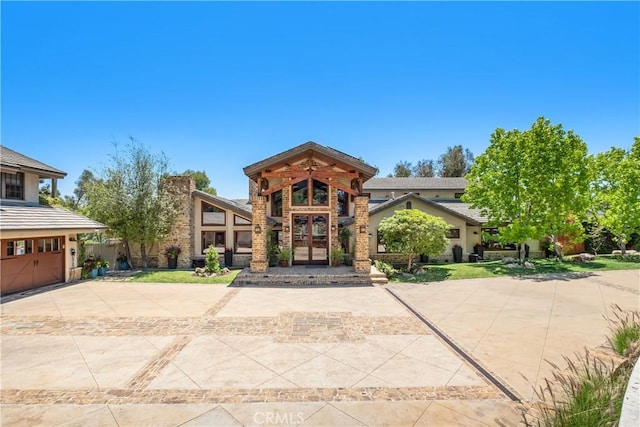 7626 E Saddlehill Trl, Orange, CA 92869 - view of front facade featuring driveway and an attached garage