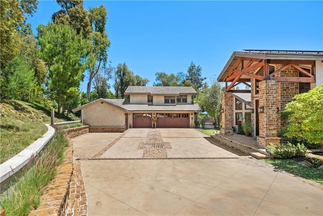 7626 E Saddlehill Trl, Orange, CA 92869 - view of front of property featuring driveway, stucco siding, and an attached garage