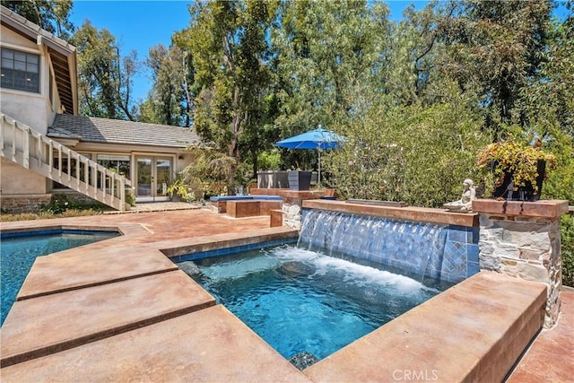 7626 E Saddlehill Trl, Orange, CA 92869 - swimming pool with an in-ground hot tub, french doors, and a patio area