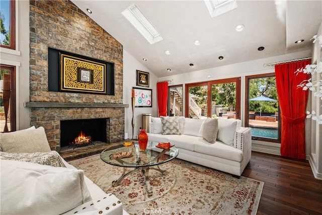 7626 E Saddlehill Trl, Orange, CA 92869 - living area with a skylight, hardwood / wood-style floors, a stone fireplace, recessed lighting, and high vaulted ceiling