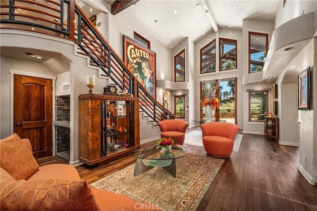 7626 E Saddlehill Trl, Orange, CA 92869 - living area featuring plenty of natural light, stairs, hardwood / wood-style floors, baseboards, and high vaulted ceiling