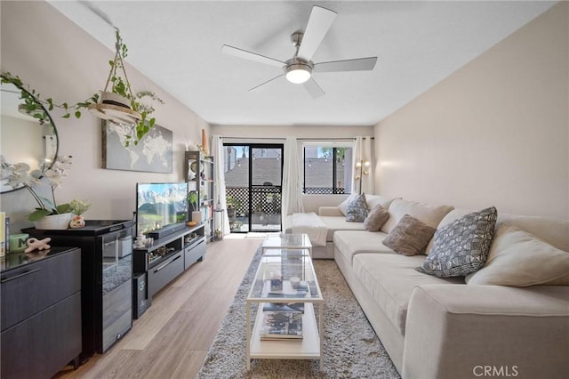 1140 Pacific Ave Unit 10, Long Beach, CA 90813 - living room with a ceiling fan and light wood-style flooring