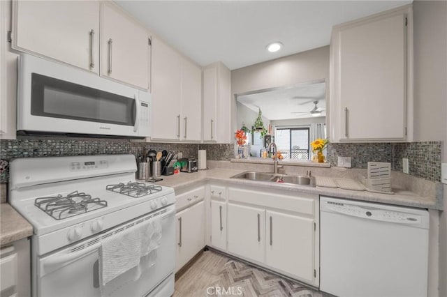 1140 Pacific Ave Unit 10, Long Beach, CA 90813 - kitchen with white appliances, a sink, light countertops, ceiling fan, and decorative backsplash