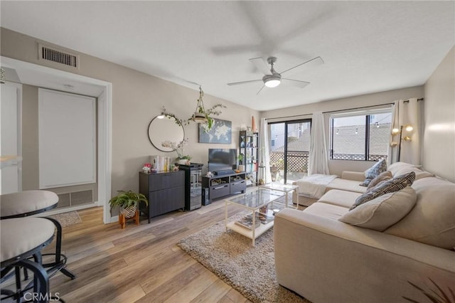 1140 Pacific Ave Unit 10, Long Beach, CA 90813 - living area featuring wood finished floors, ceiling fan, and baseboards