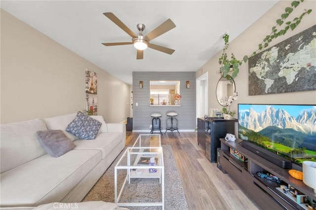 1140 Pacific Ave Unit 10, Long Beach, CA 90813 - living room featuring wood finished floors, a ceiling fan, and baseboards