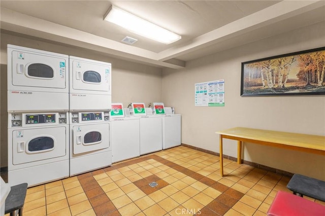 1140 Pacific Ave Unit 10, Long Beach, CA 90813 - community laundry room with stacked washer / dryer, separate washer and dryer, light tile patterned flooring, and baseboards