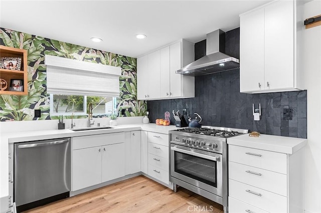 6324 E Colorado St, Long Beach, CA 90803 - kitchen featuring stainless steel appliances, wall chimney exhaust hood, a sink, open shelves, and recessed lighting